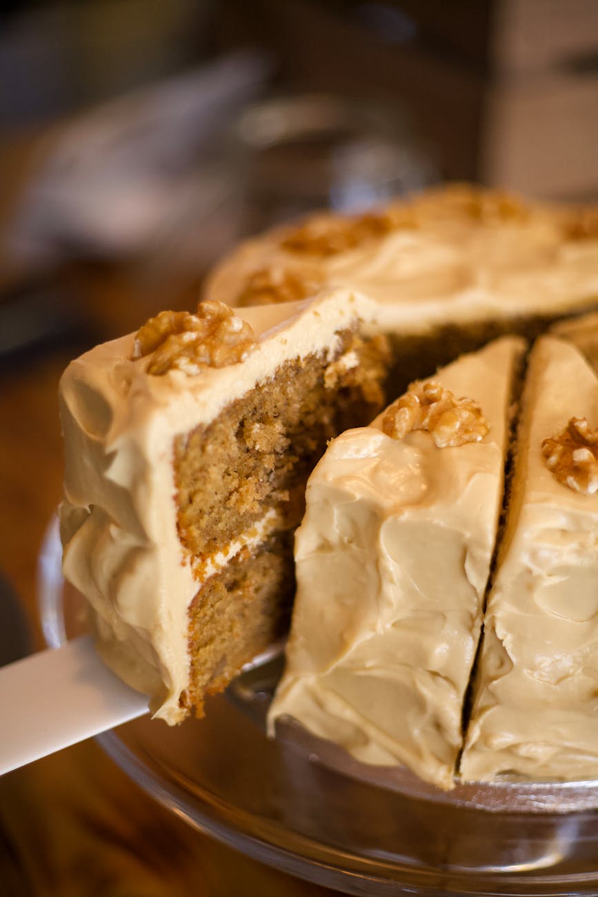 brown sliced cake on clear glass of plate